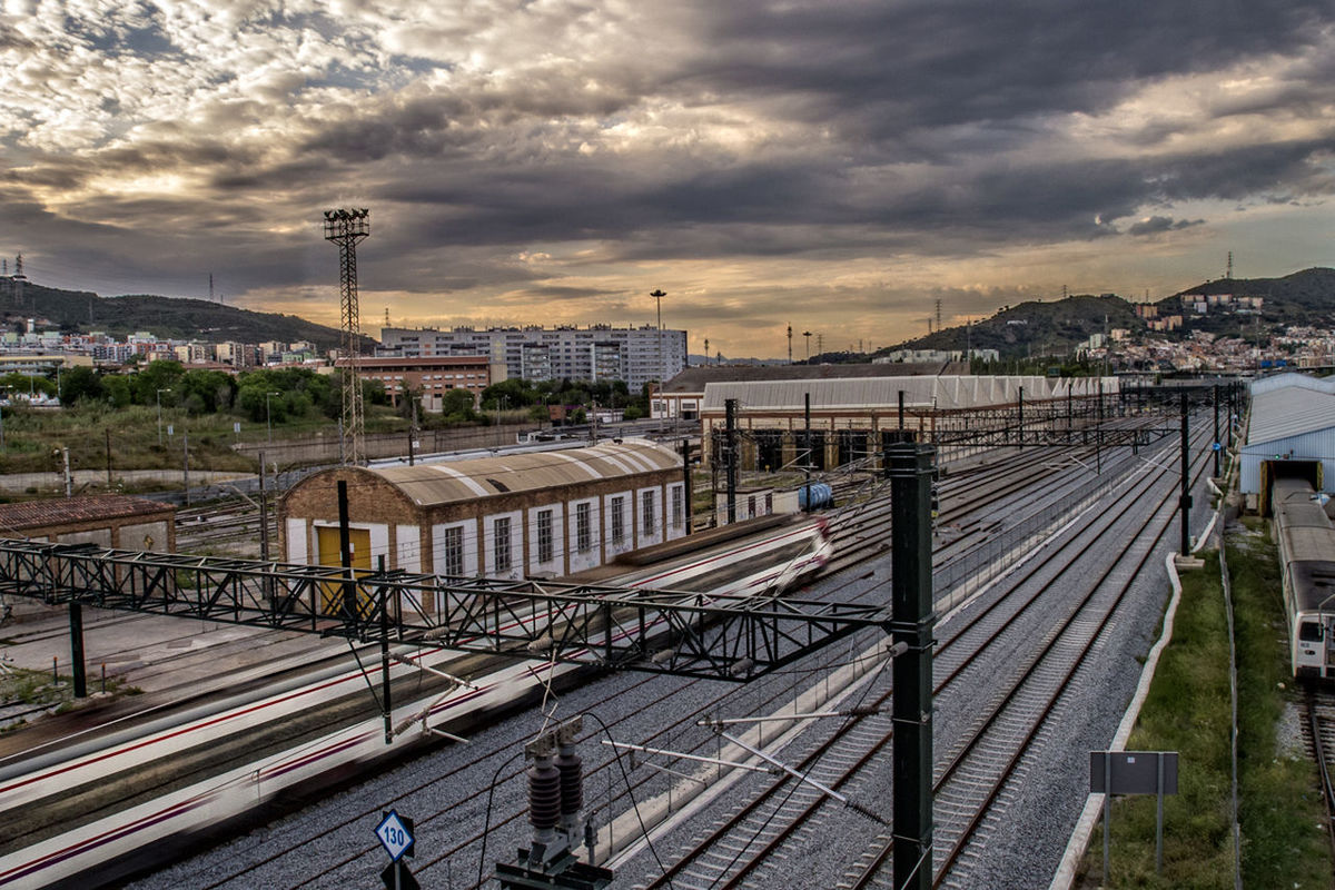 High angle view of railroad tracks against cloudy sky