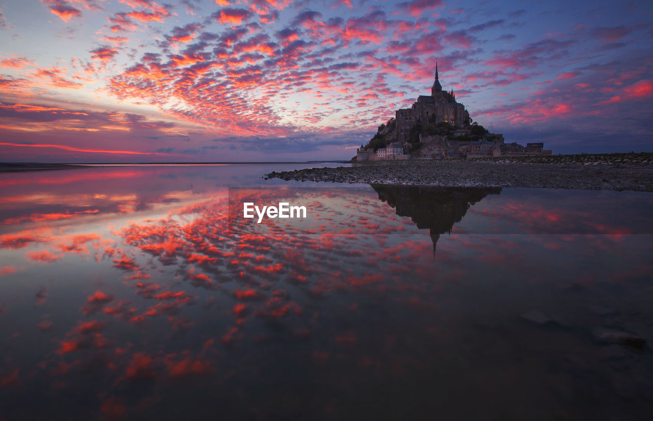 Landscape from the west coast of france at atlantic ocean. sunset with mont saint michel.