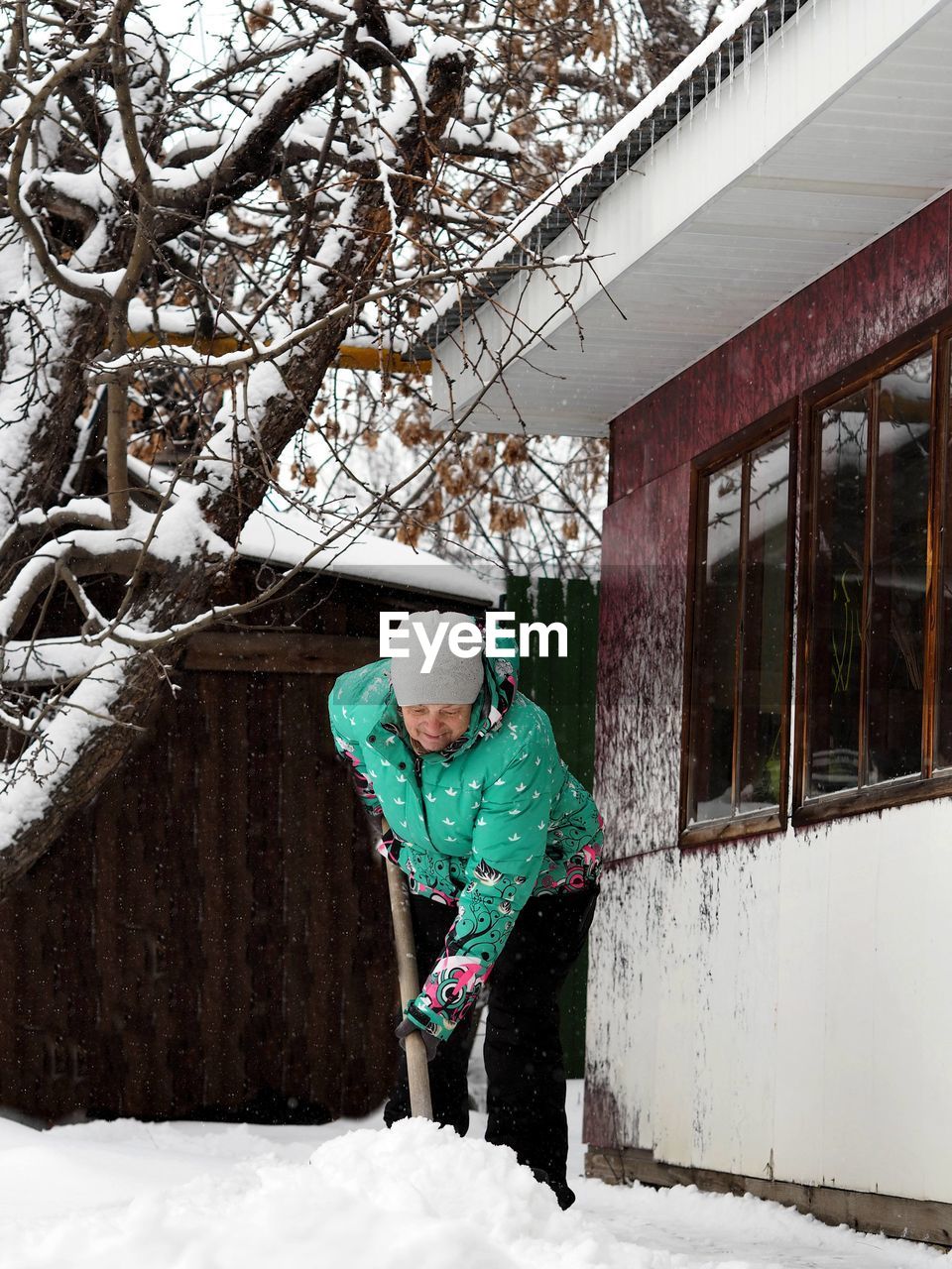 side view of boy standing on snow