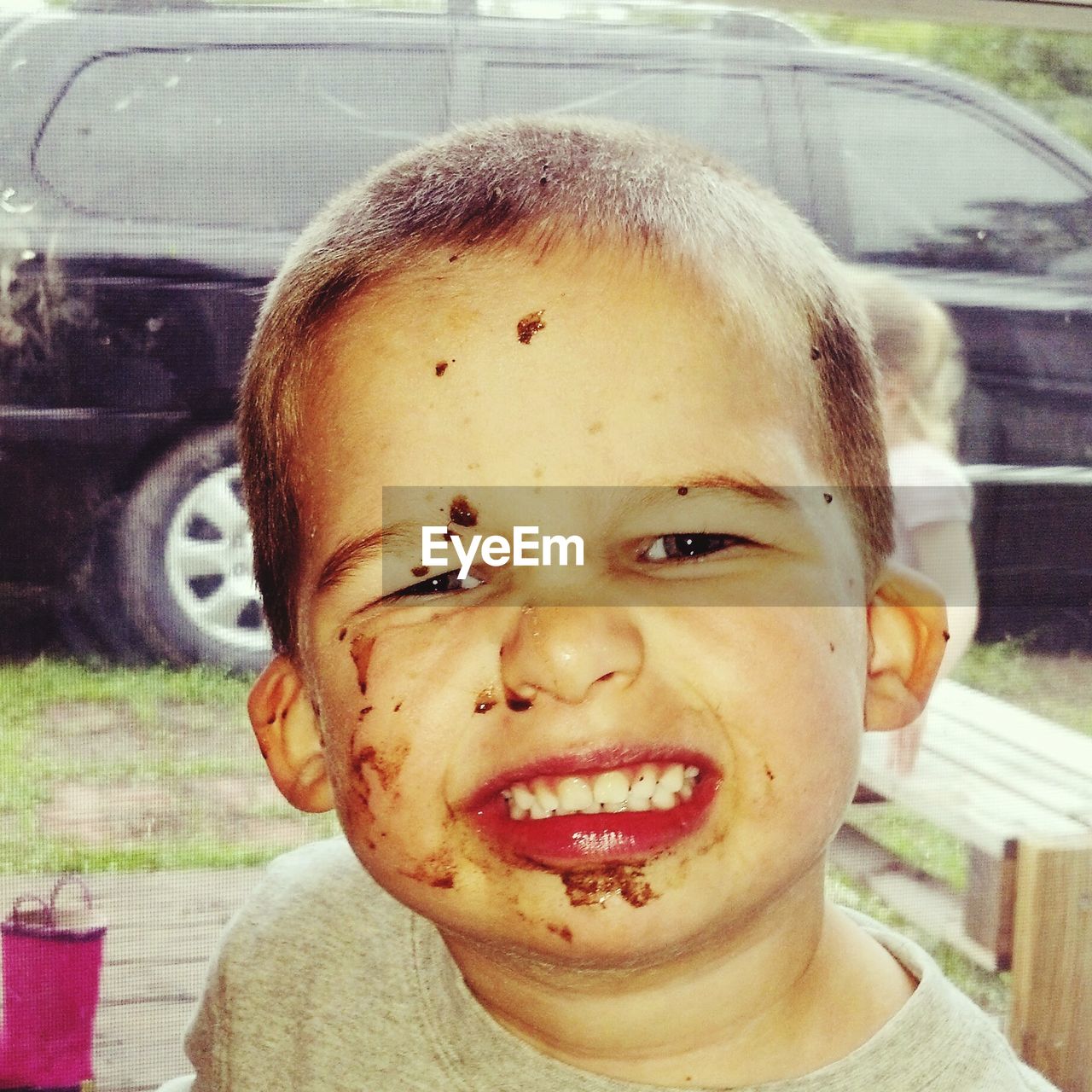 Close-up portrait of boy winking eye