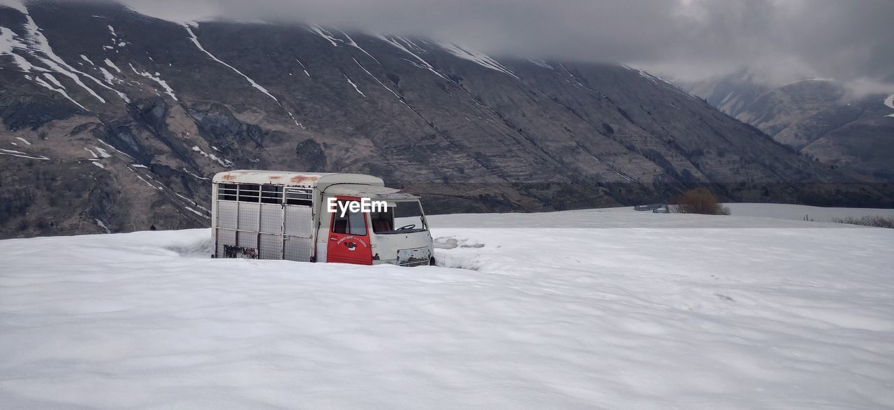 LIFEGUARD HUT ON SNOWCAPPED MOUNTAIN