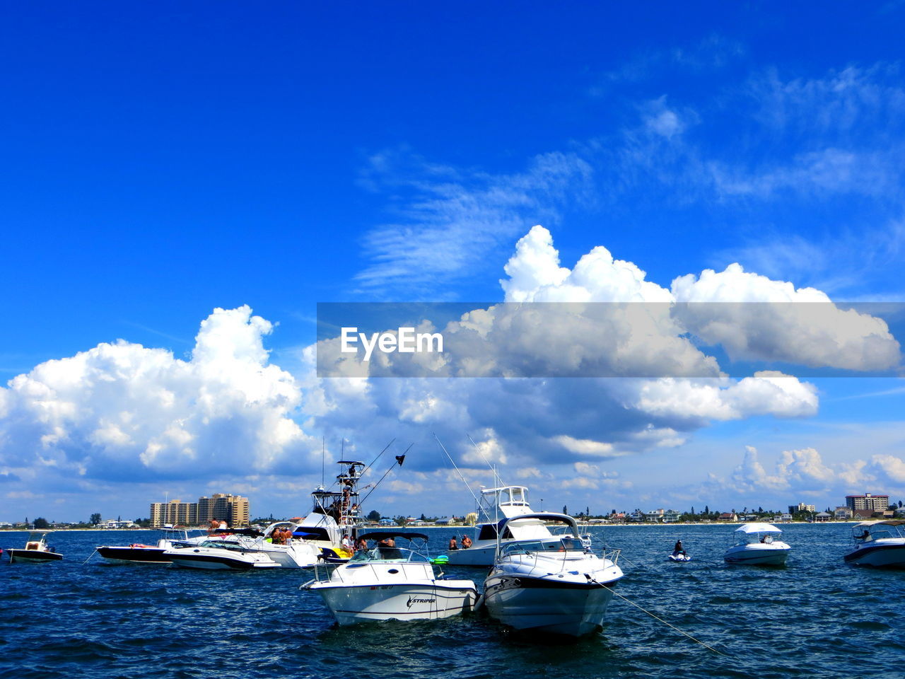 BOATS SAILING ON SEA