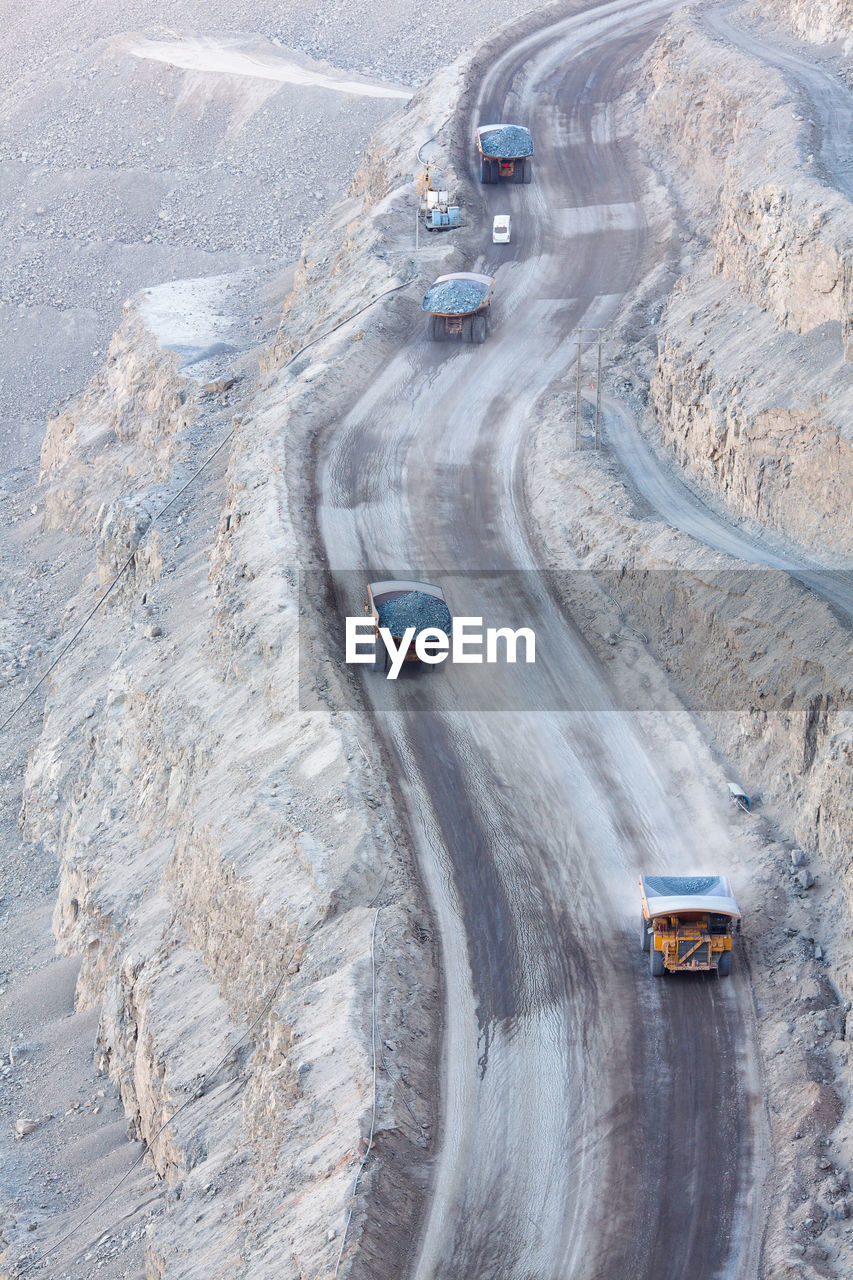 High angle view of trucks moving on road