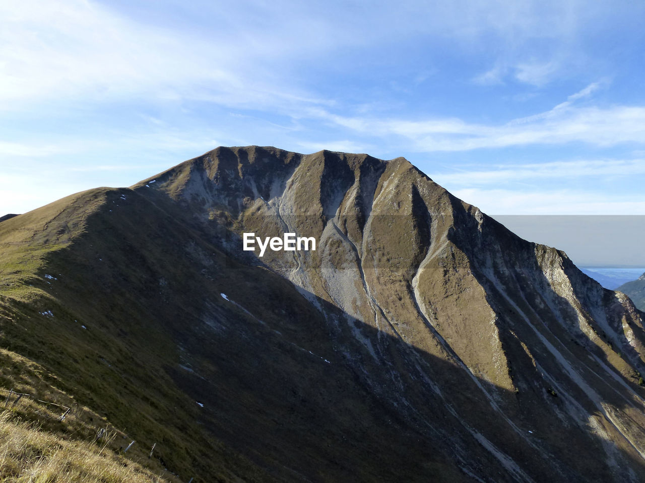 panoramic view of rocky mountains against sky