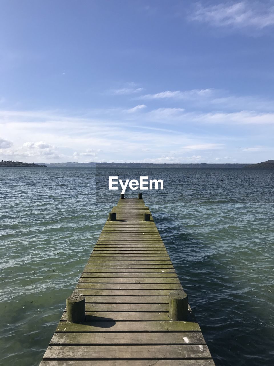 Pier over sea against sky