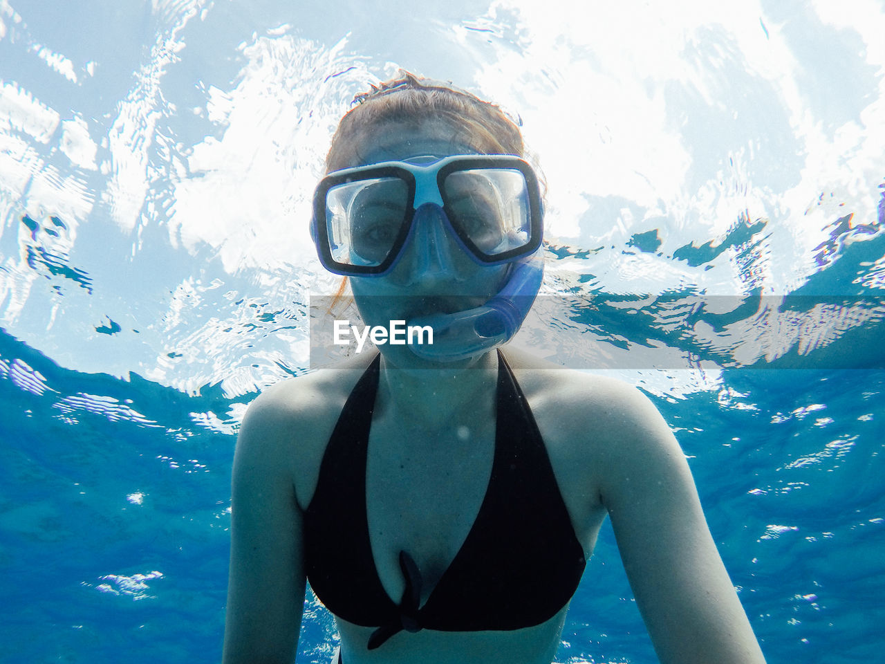 Woman swimming undersea