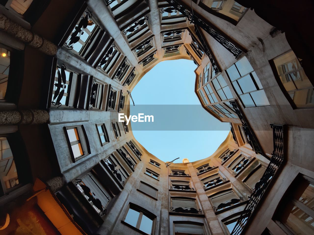 Directly below shot of building against clear sky