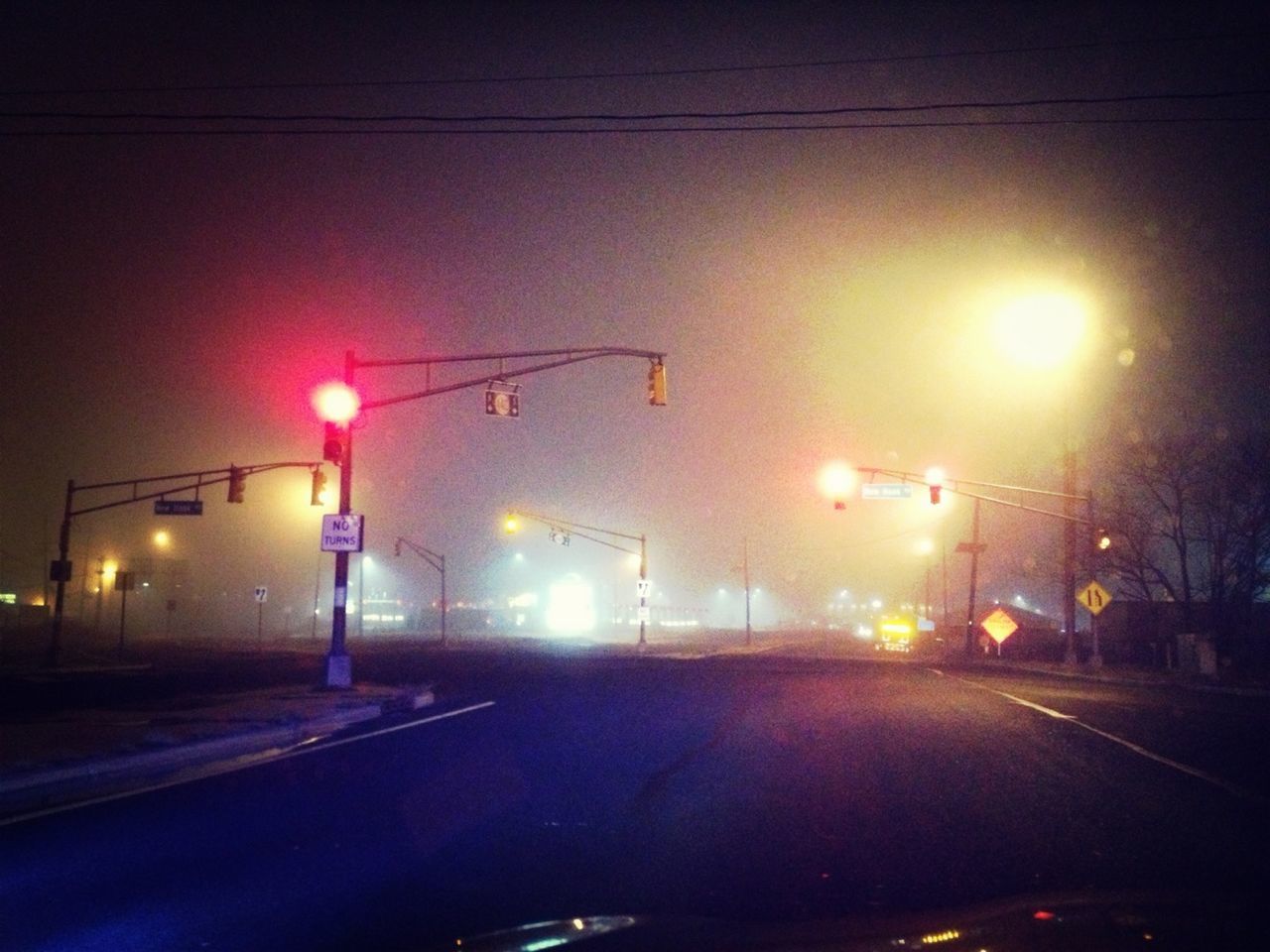 Illuminated street lights at night