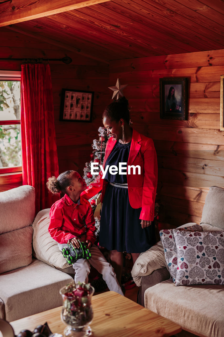 Happy woman with her daughter at home