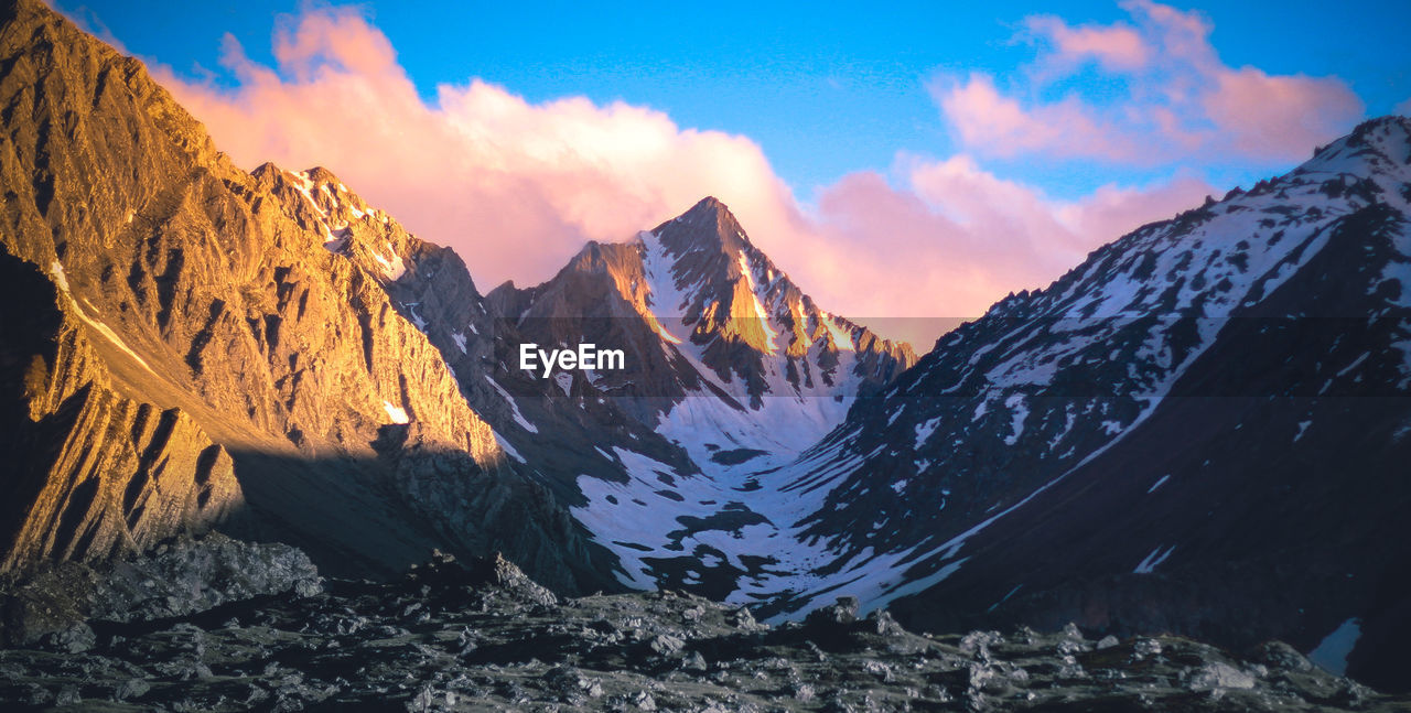 Panoramic view of snowcapped mountains against sky