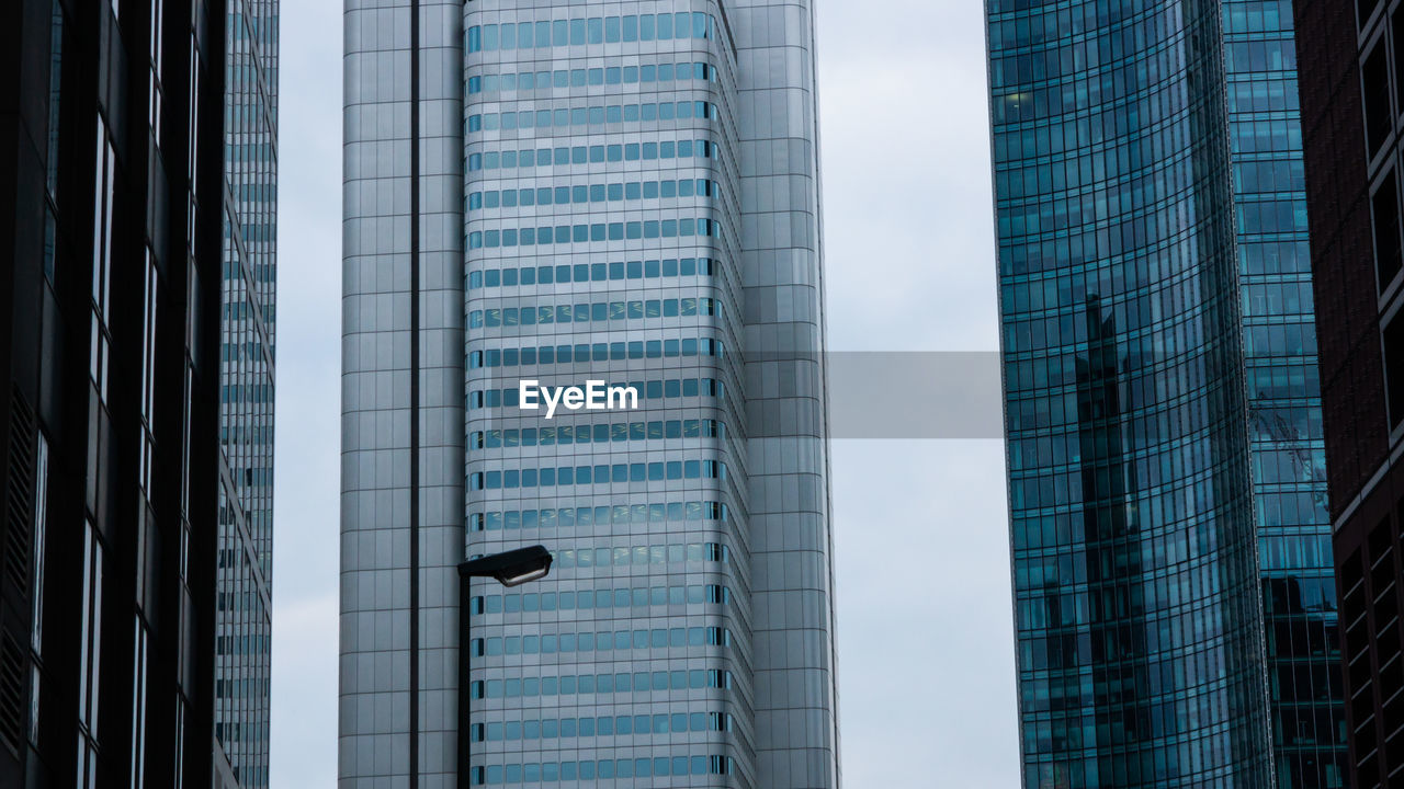 Low angle view of modern buildings against sky