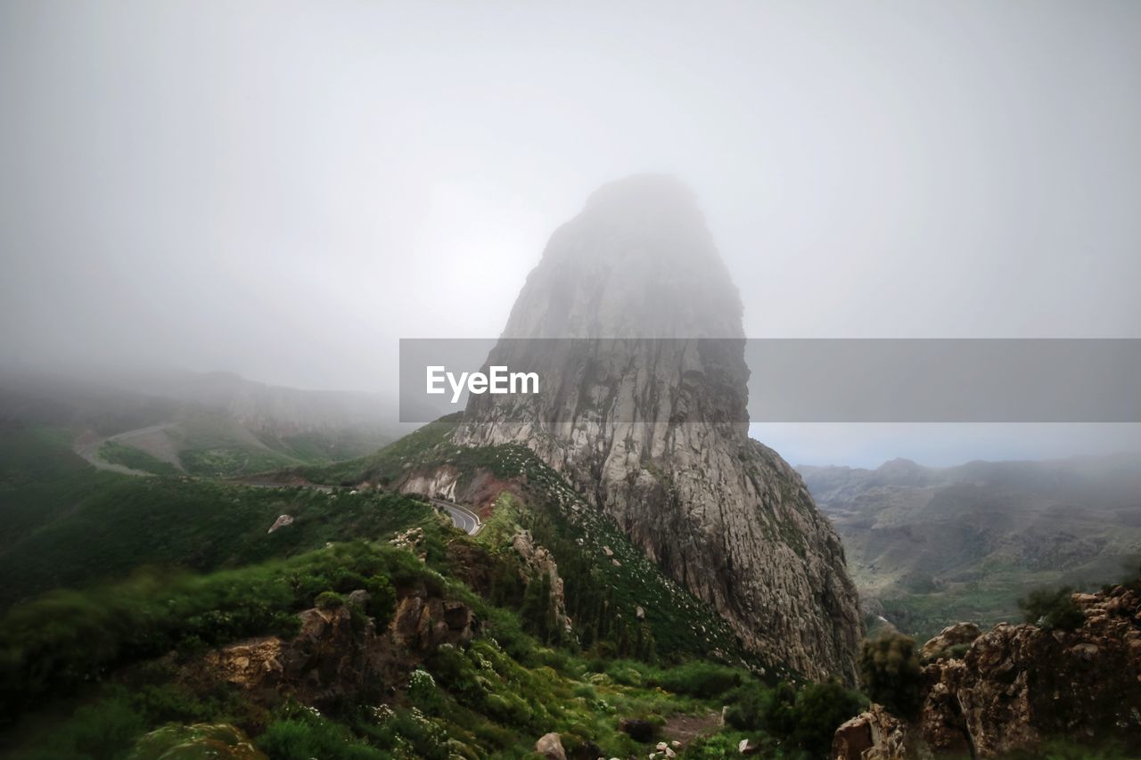 Scenic view of rocky mountains against sky