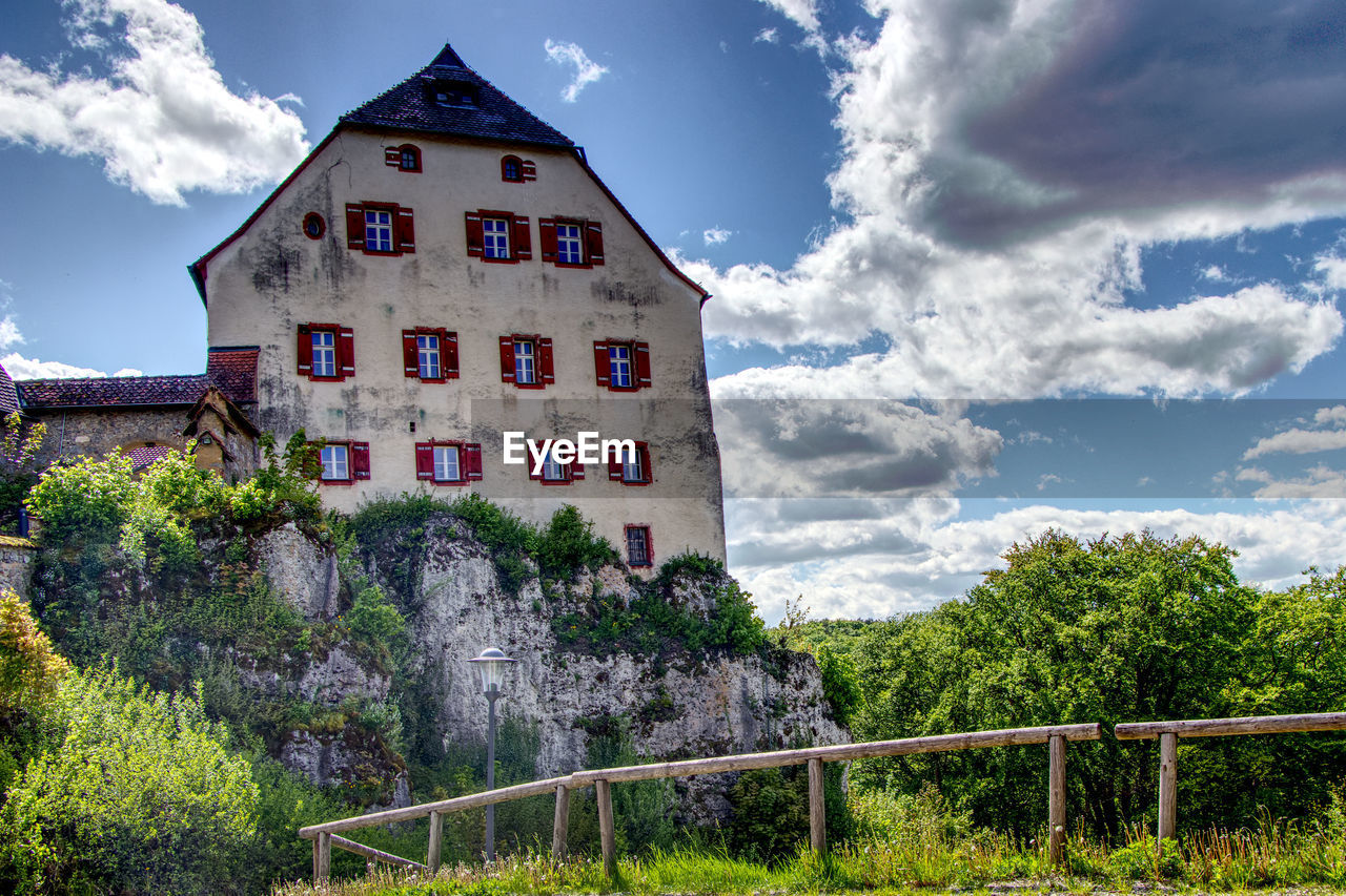 View of a castle against cloudy sky