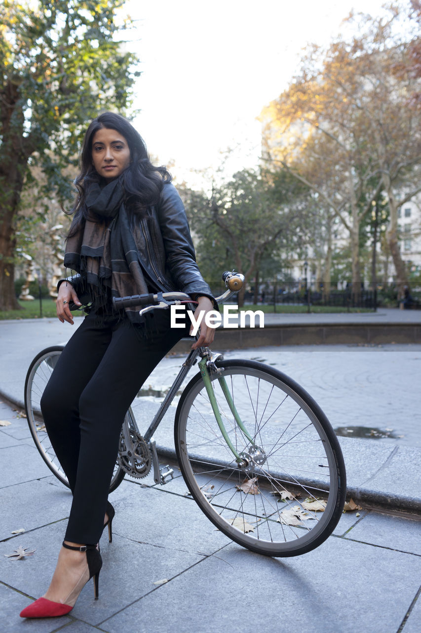 Portrait of a young woman in an urban park