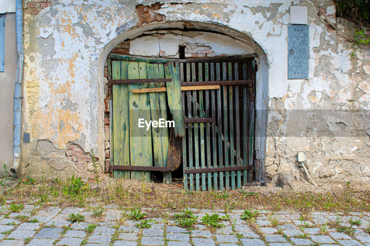 Abandoned wooden door of old house