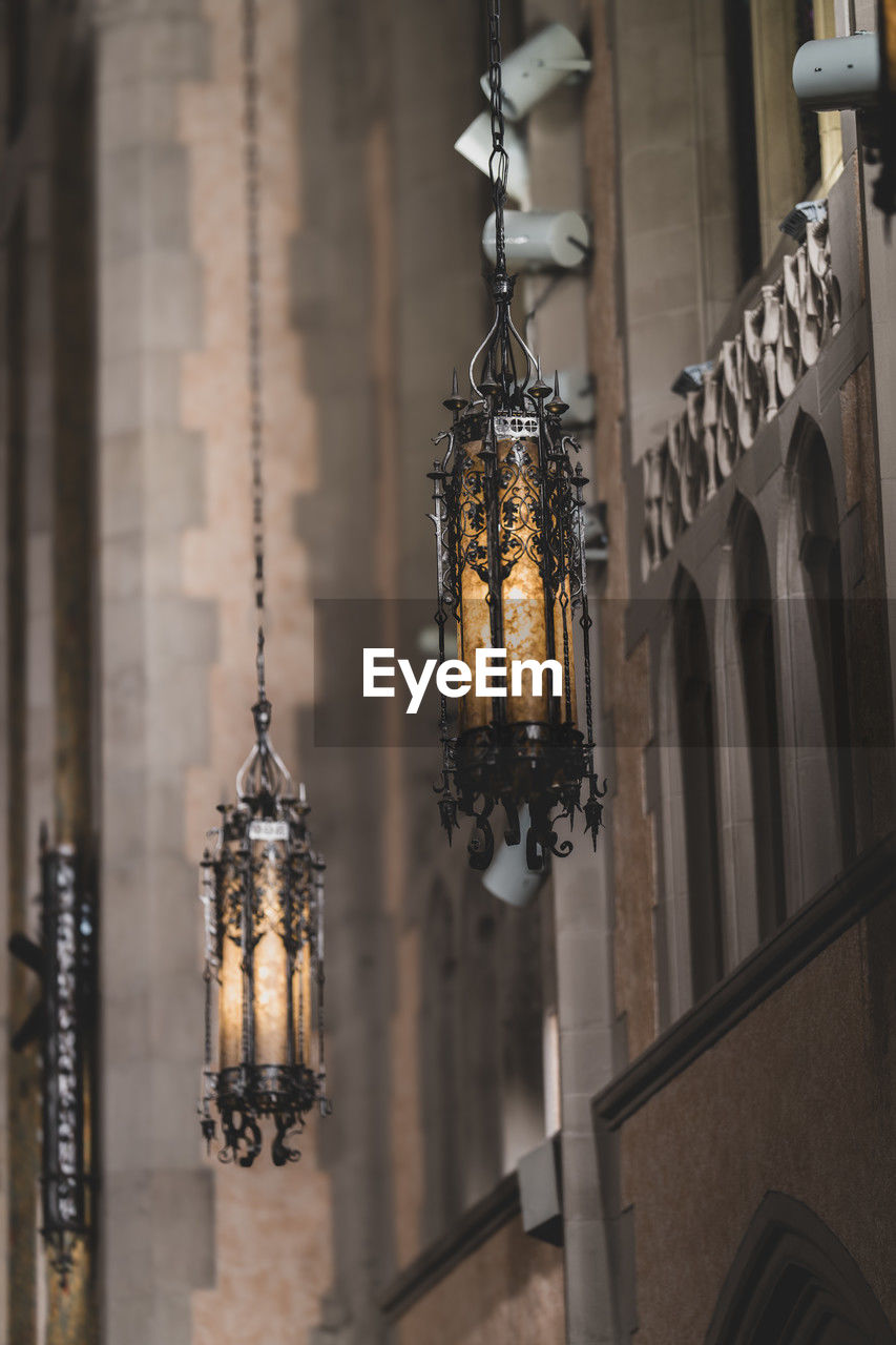 Low angle view of illuminated gothic style chandelier