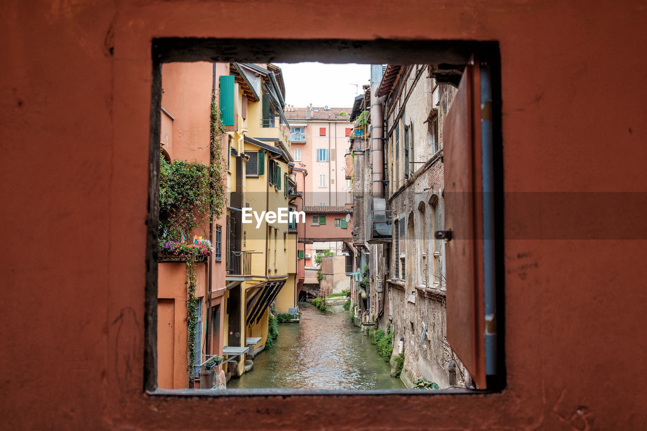 Canal seen through window in the wall