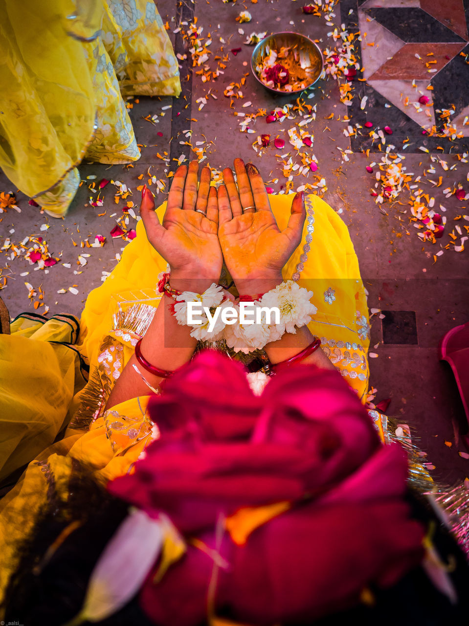 High angle view of bride sitting in haldi ceremony