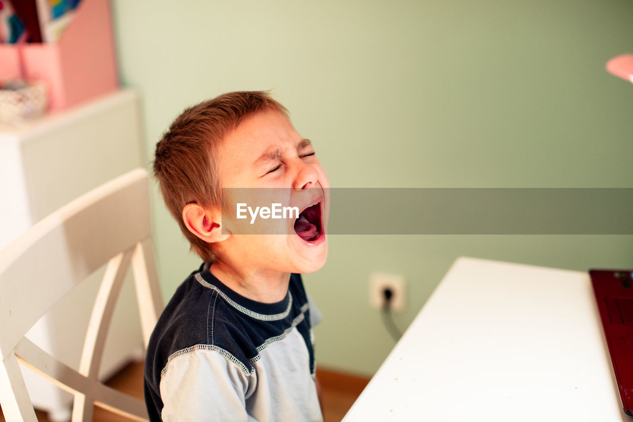 Portrait of boy at home