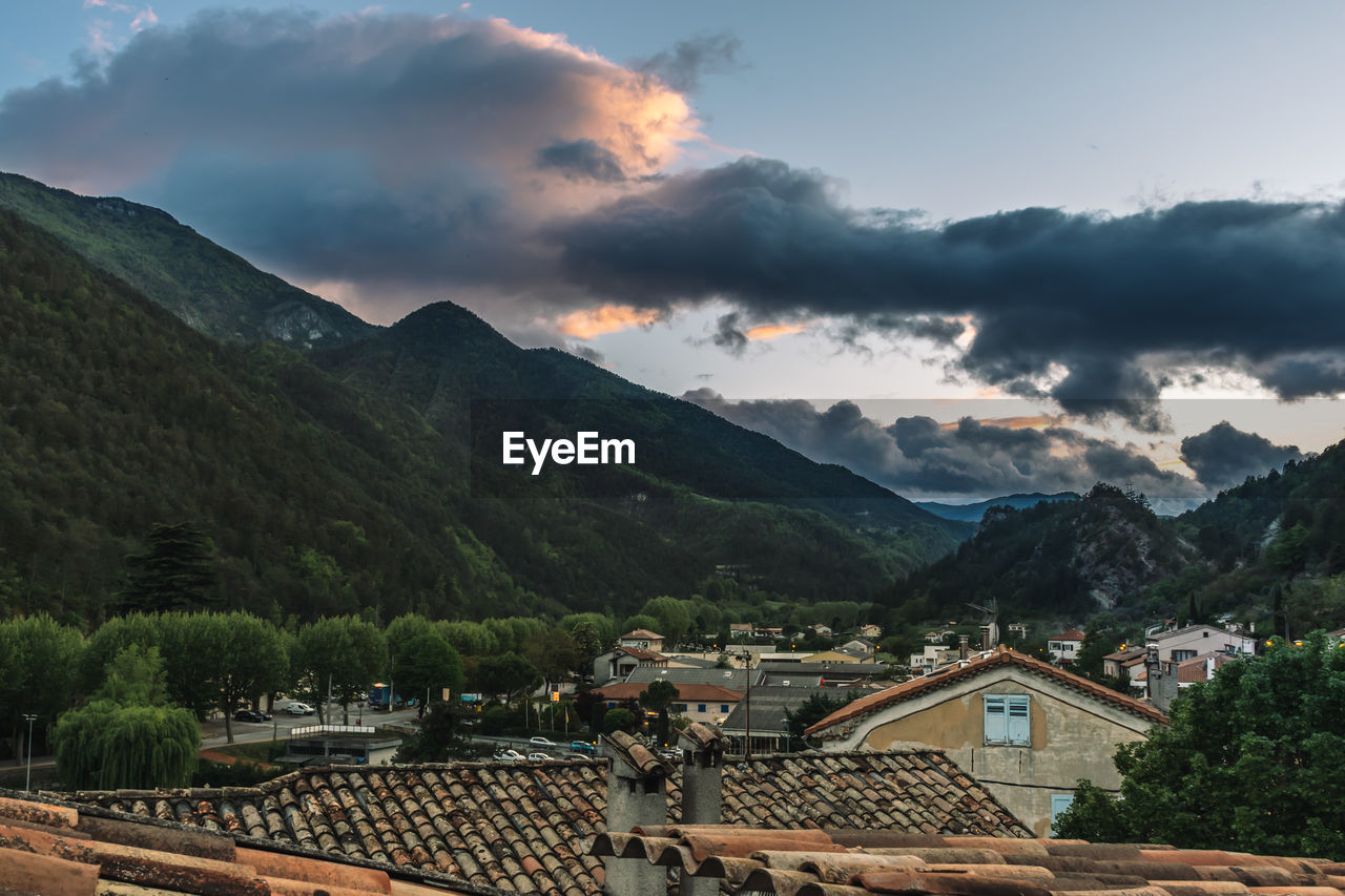 View of town against sky during dawn