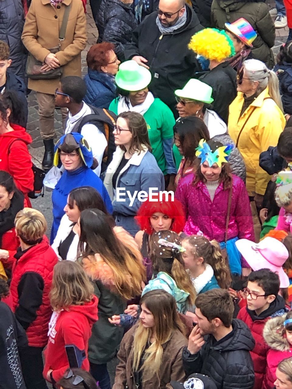 HIGH ANGLE VIEW OF PEOPLE ON STREET