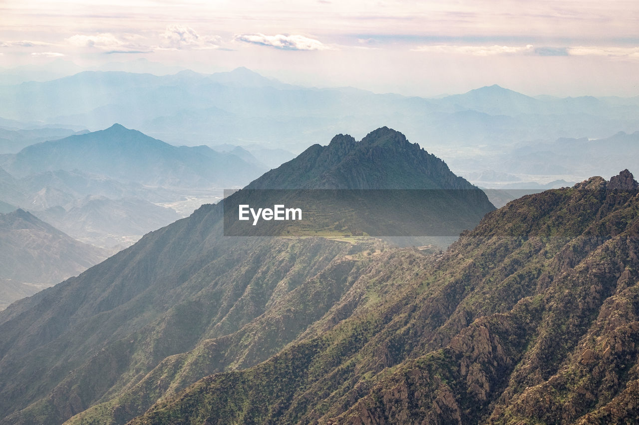 Scenic view of mountains against sky at sunset