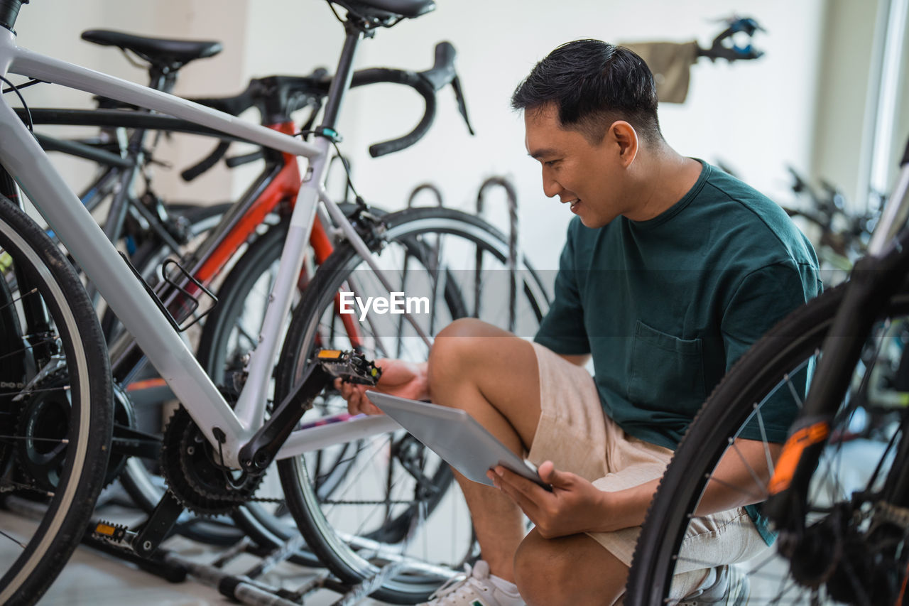 side view of man riding bicycle