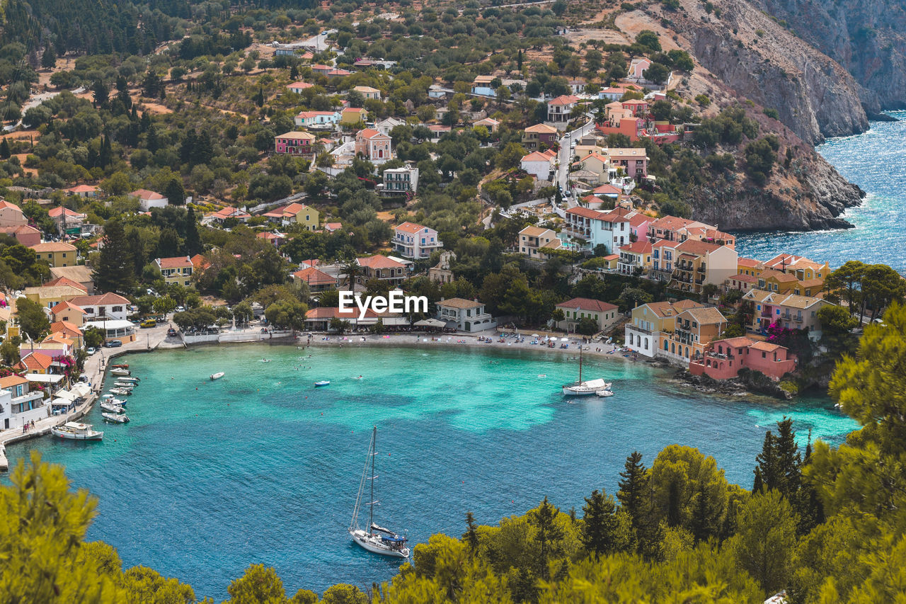 High angle view of townscape by sea
