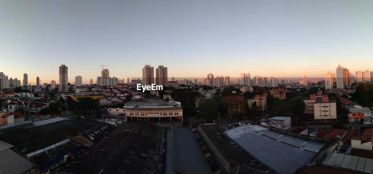 Aerial view of cityscape against clear sky