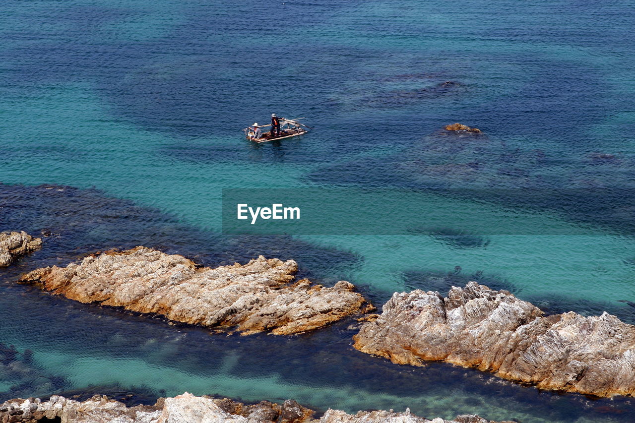 High angle view of boat floating on sea