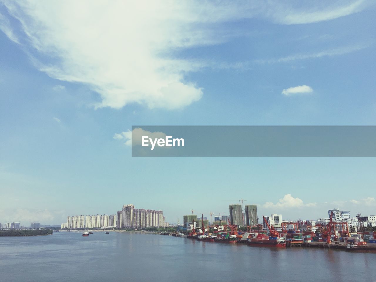 SEA AND BUILDINGS AGAINST SKY