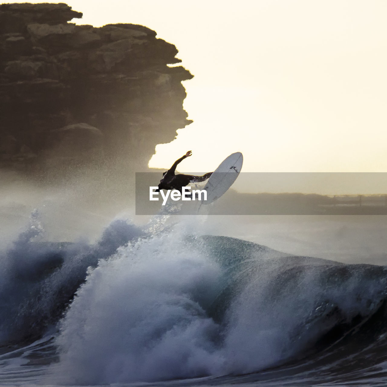 Rear view of men doing water surfing