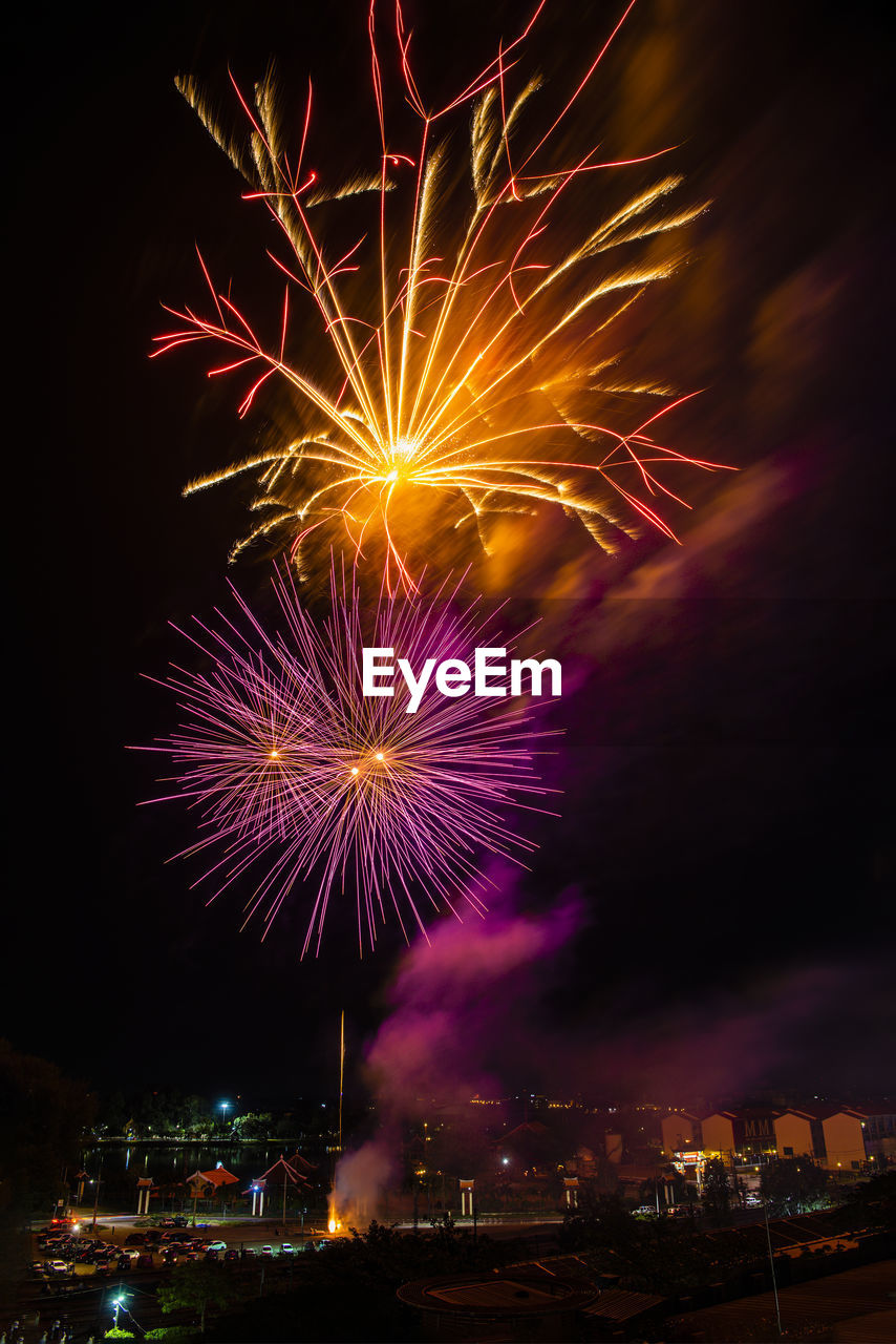 Bright colorful fireworks on black sky night background