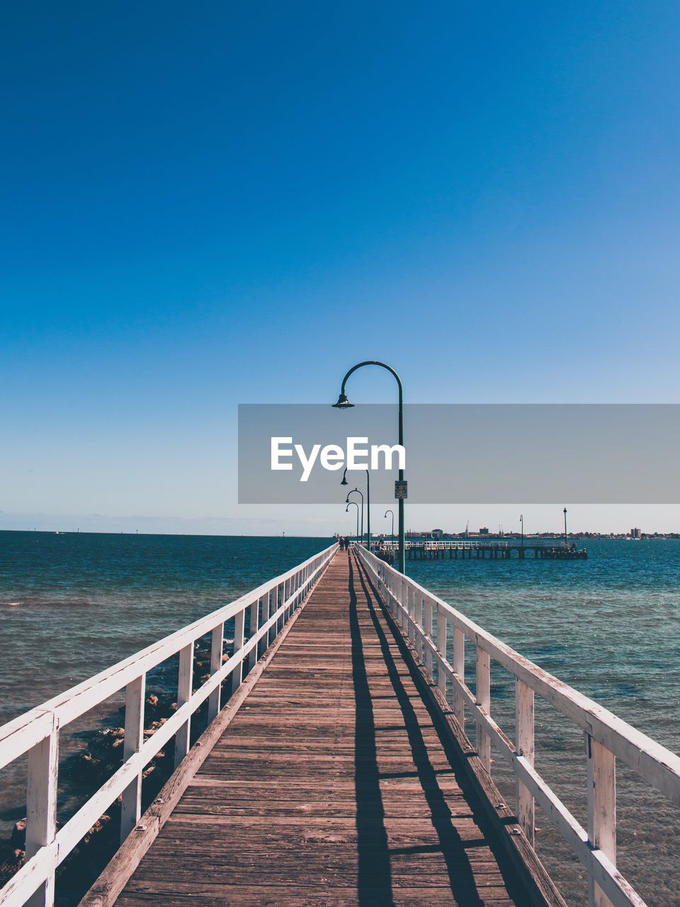 Beautiful wooden pier on an australian beach against clear sky