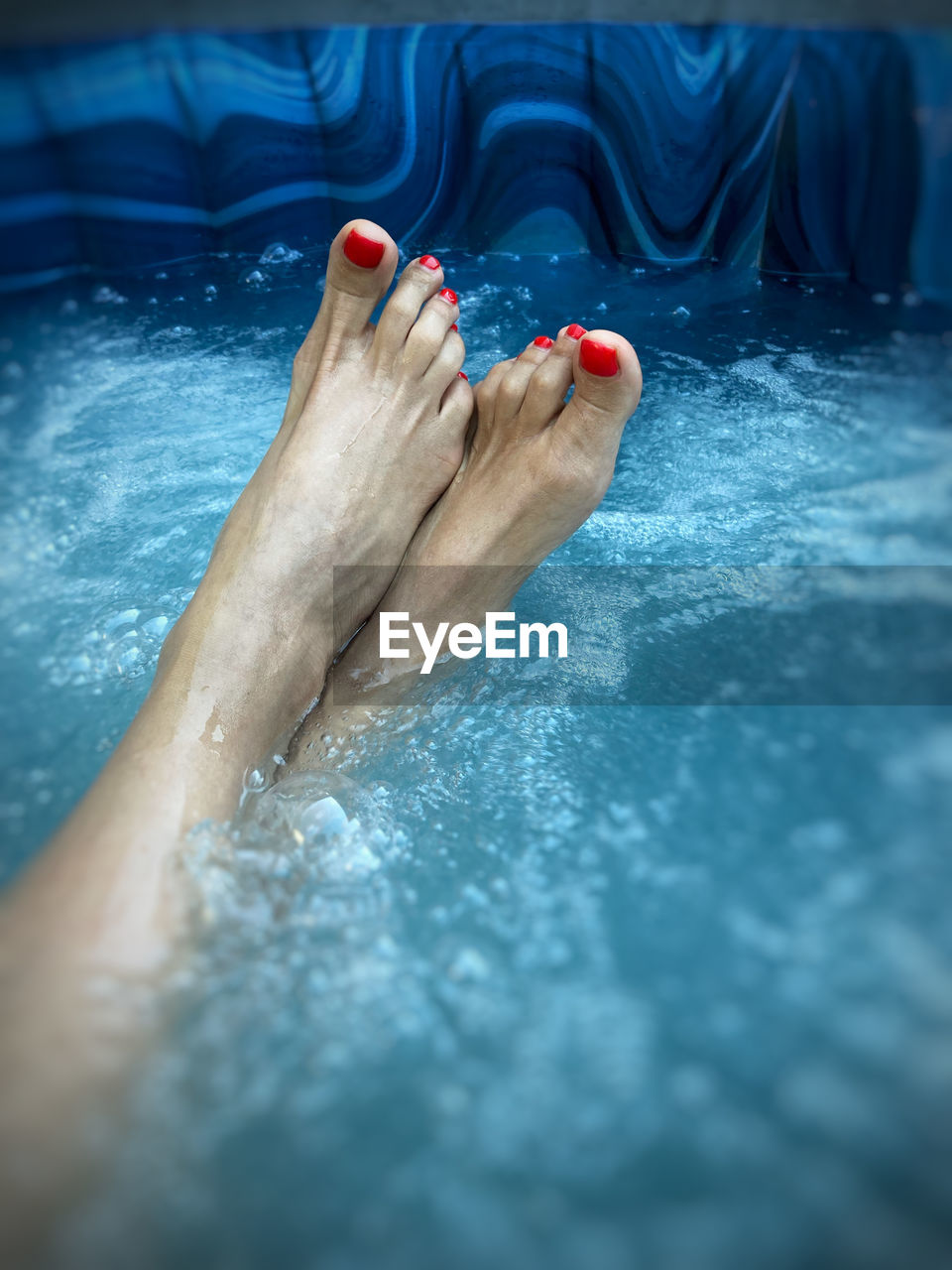 water, swimming, adult, one person, swimming pool, relaxation, women, human foot, lifestyles, barefoot, human leg, nature, nail polish, wellbeing, nail, leisure activity, low section, wet, limb, health spa, holiday, sports, blue, food and drink, human limb, vacation, trip, toe, spa treatment, body care, beauty spa, spa, outdoors