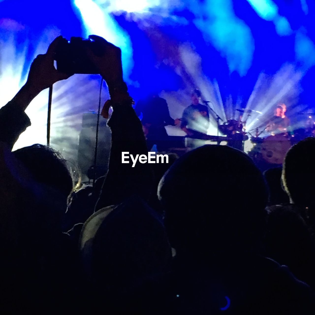 Silhouette people at music concert