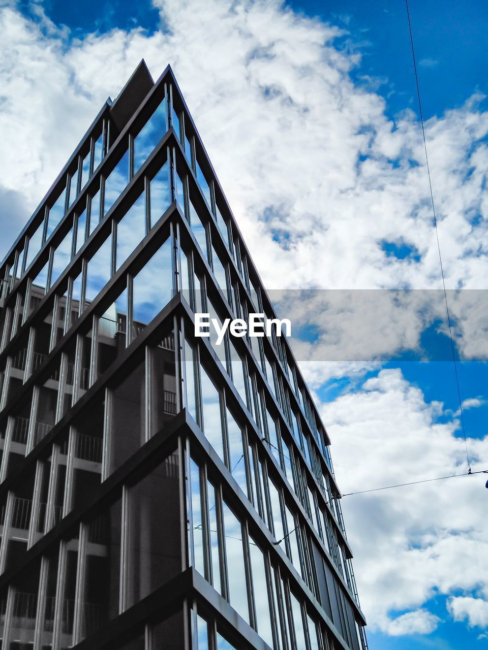 Low angle view of modern building against sky