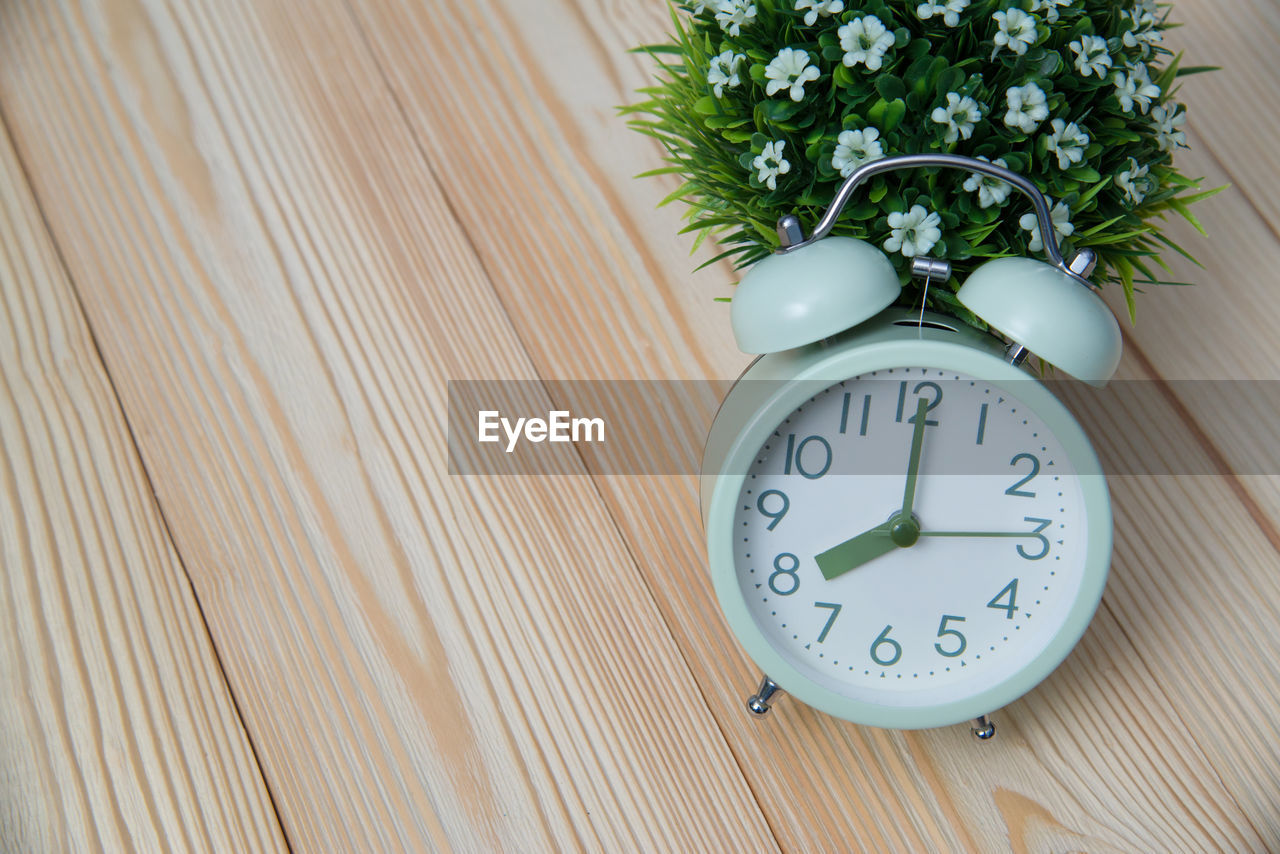 CLOSE-UP OF CLOCK ON WALL