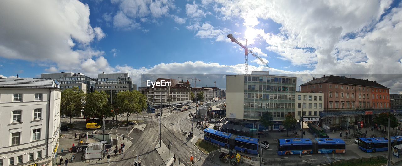 HIGH ANGLE VIEW OF STREET AMIDST BUILDINGS IN CITY