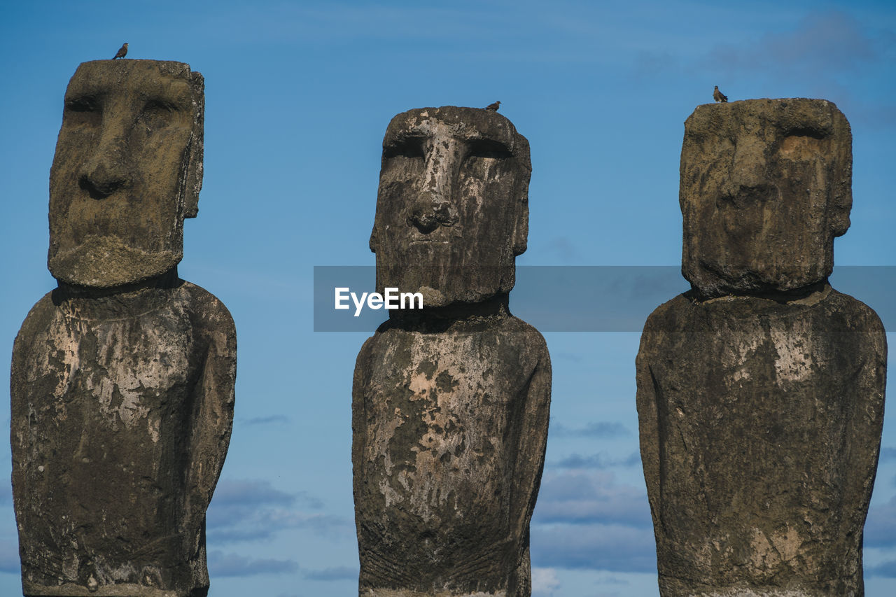 Moai statues against sky