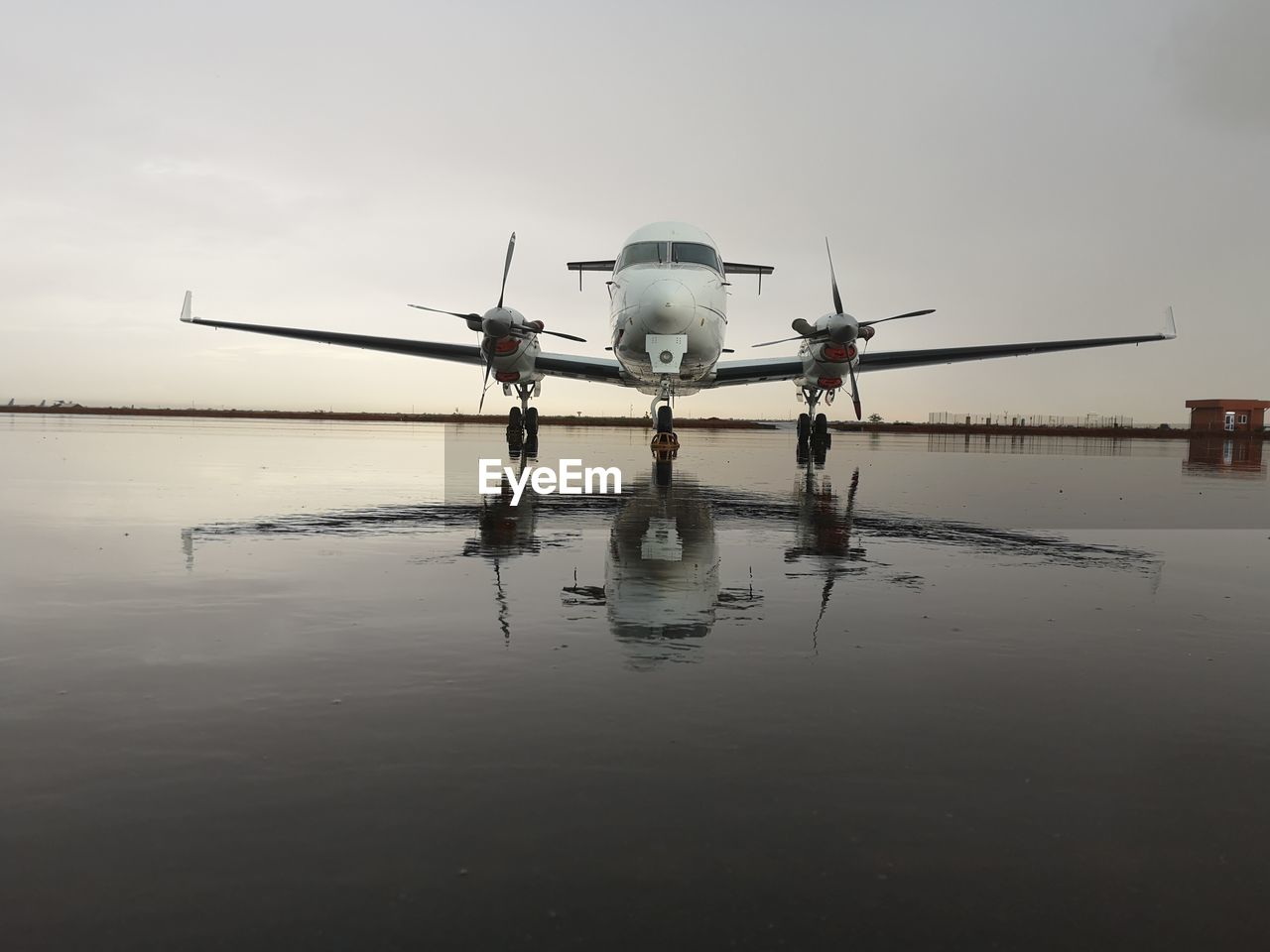 Airplane against sky at dusk