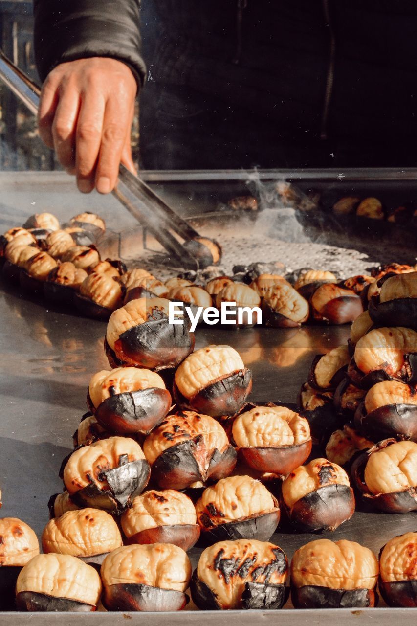 Close-up of person preparing food in cooking oil