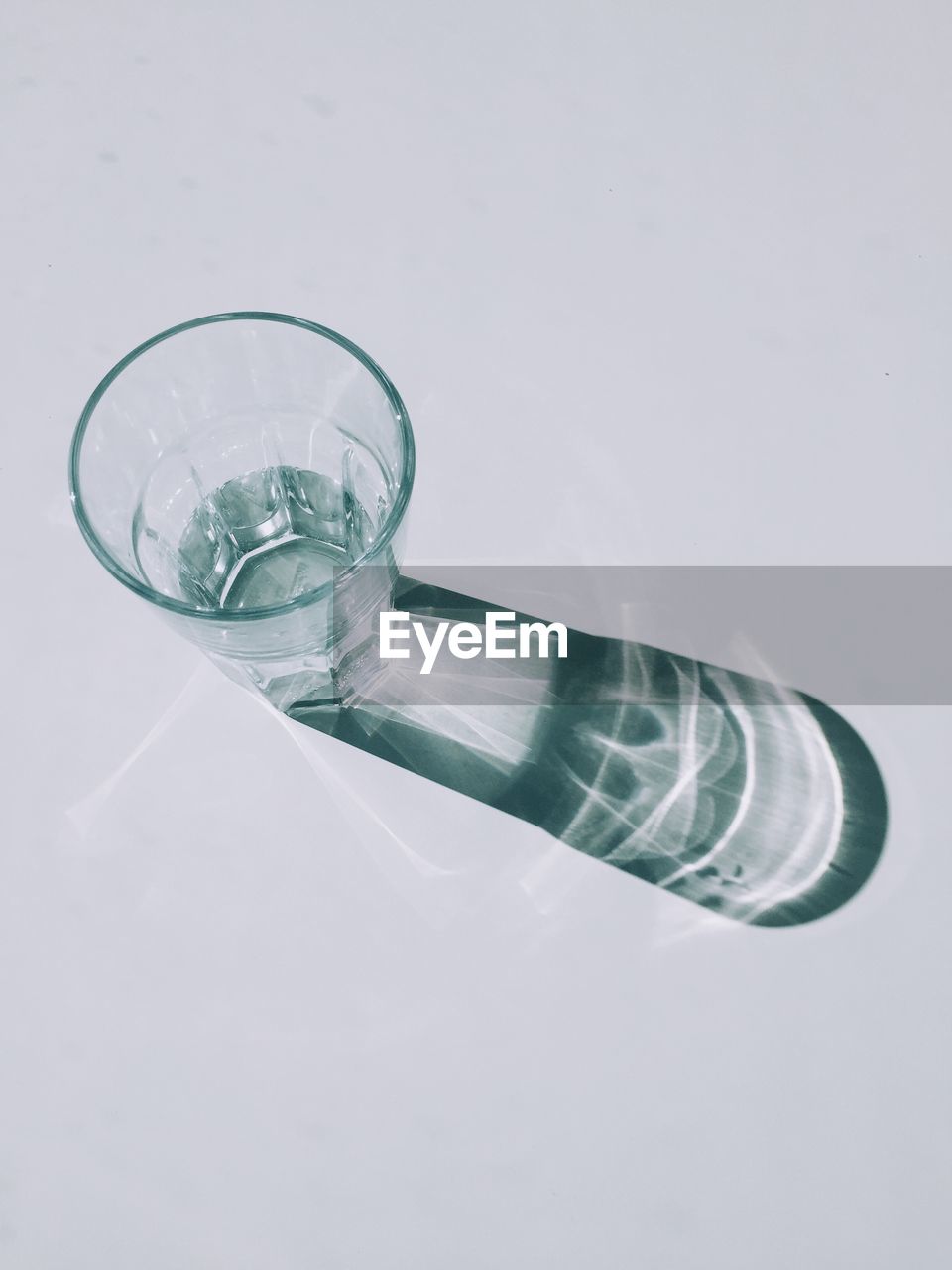 Glass of water on white background