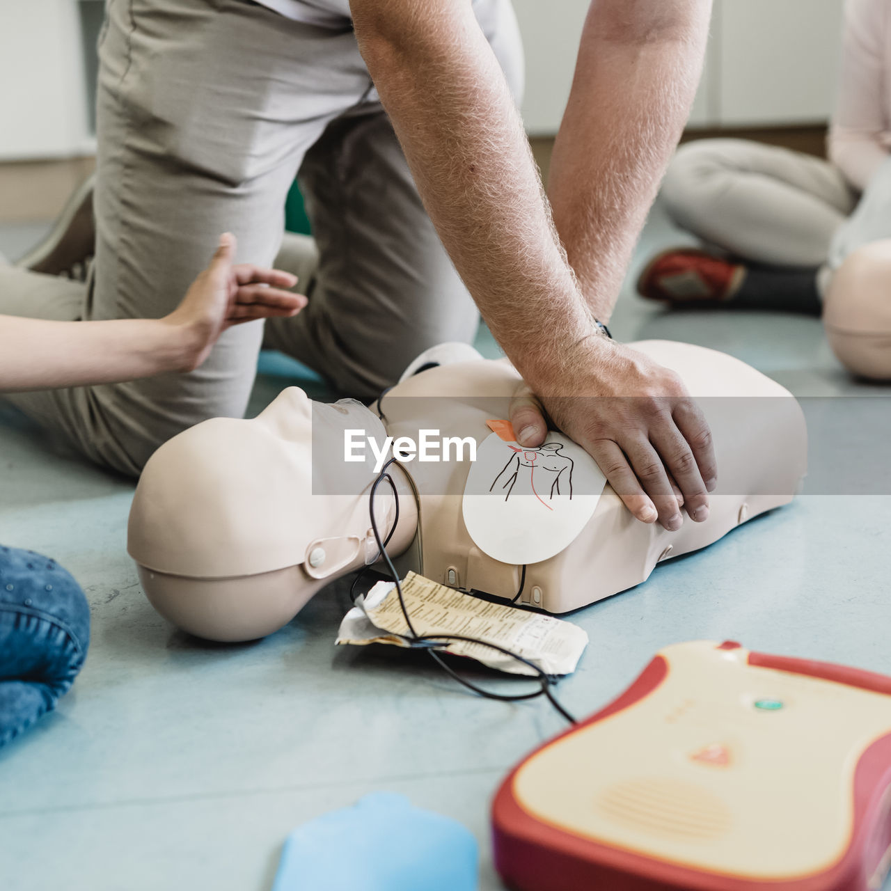 midsection of man giving massage to patient in clinic