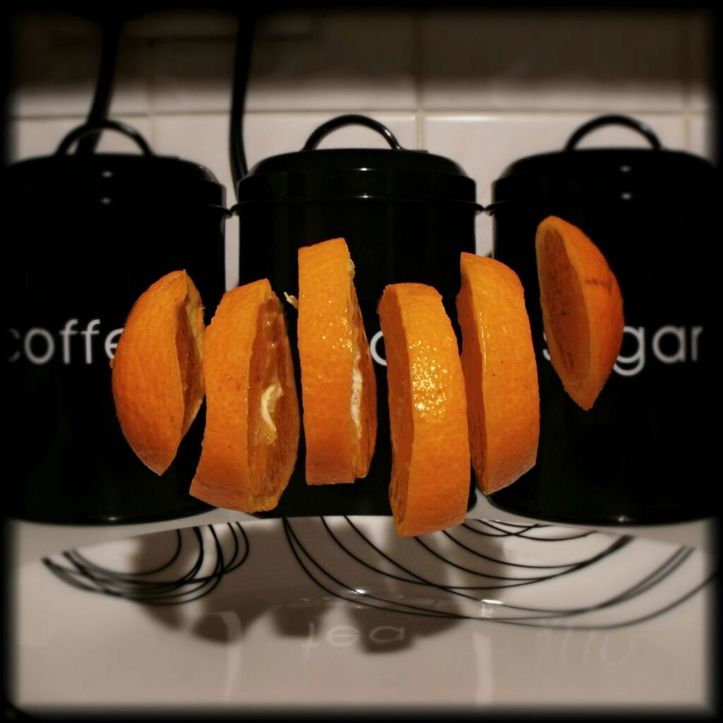 Sliced orange in mid-air