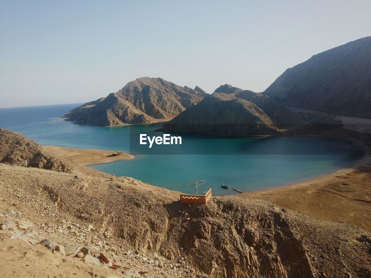 Scenic view of beach against clear sky