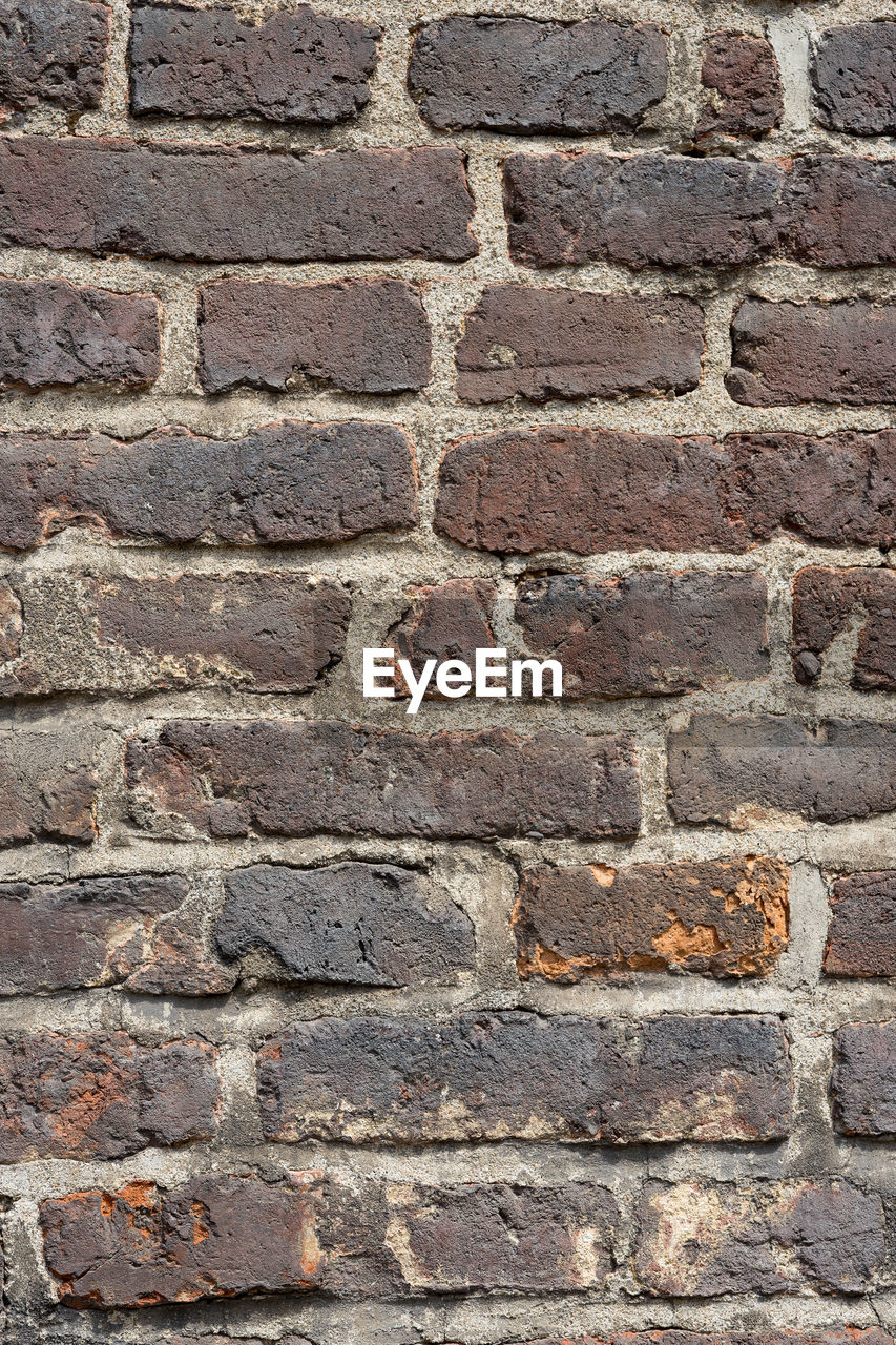 DETAIL SHOT OF BRICK WALL