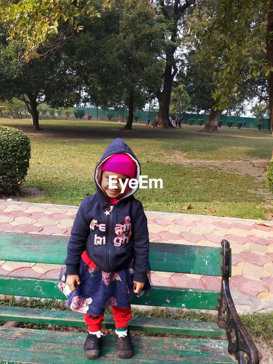 FULL LENGTH PORTRAIT OF BOY STANDING ON PARK