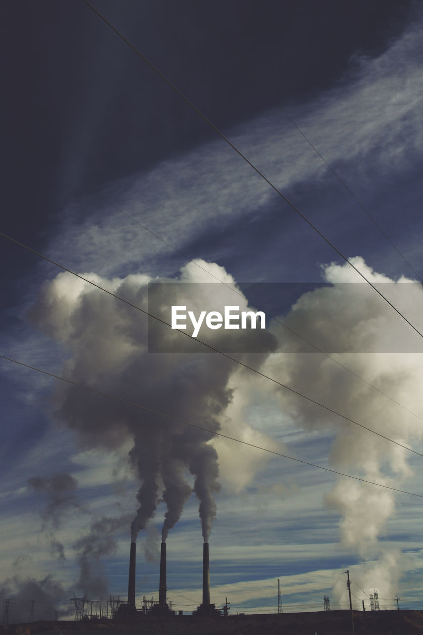 LOW ANGLE VIEW OF VAPOR TRAILS IN SKY