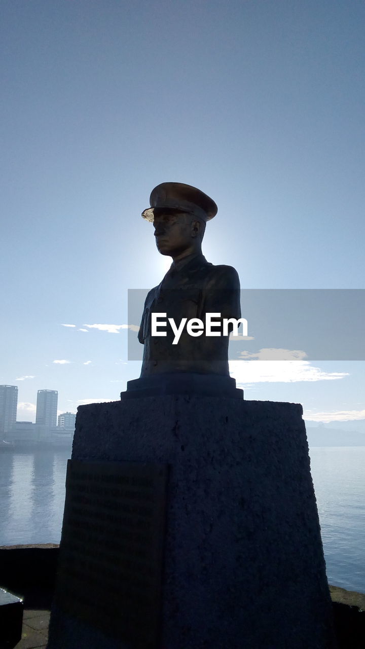 Low angle view of statue against sky